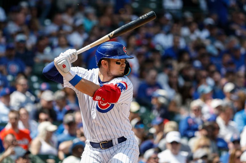 May 5, 2023; Chicago, Illinois, USA; Chicago Cubs right fielder Seiya Suzuki (27) bats against the Miami Marlins during the third inning at Wrigley Field. Mandatory Credit: Kamil Krzaczynski-USA TODAY Sports