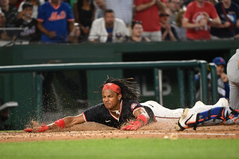 Jul 3, 2024; Washington, District of Columbia, USA; Washington Nationals shortstop CJ Abrams (5) slides head first in home plate to score a run against the New York Mets during the seventh inning at Nationals Park. Mandatory Credit: Rafael Suanes-USA TODAY Sports