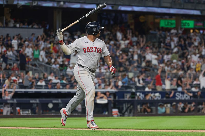 Jul 7, 2024; Bronx, New York, USA; Boston Red Sox third baseman Rafael Devers (11) reacts after his solo home run during the seventh inning against the New York Yankees at Yankee Stadium. Mandatory Credit: Vincent Carchietta-USA TODAY Sports