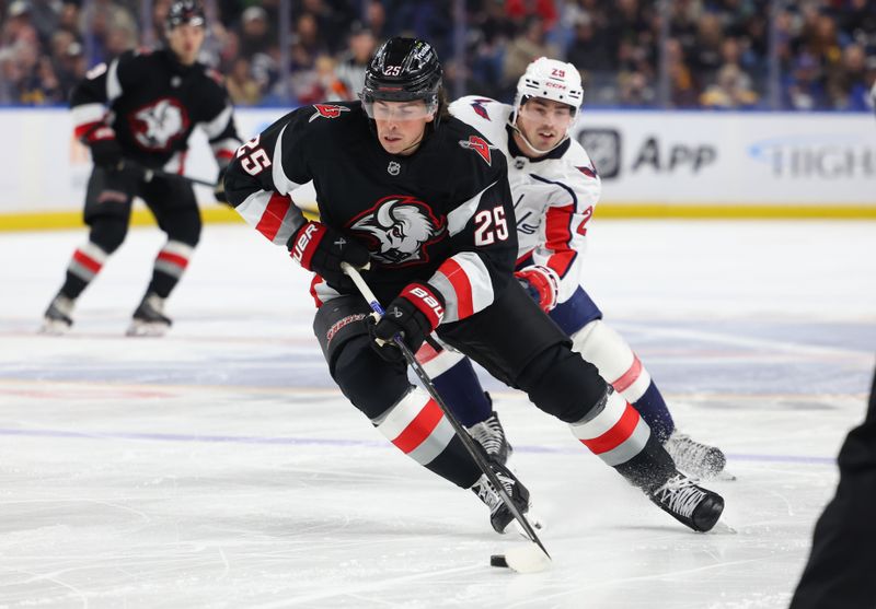 Mar 12, 2026; Buffalo, New York, USA;  Buffalo Sabres defenseman Owen Power (25) carries the puck during the first period against the Washington Capitals at KeyBank Center. Mandatory Credit: Timothy T. Ludwig-Imagn Images
