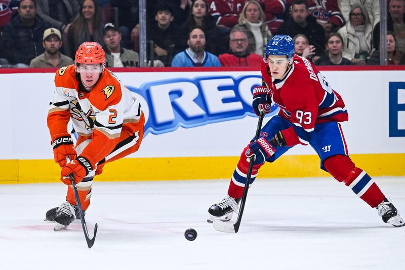 Mar 15, 2026; Montreal, Quebec, CAN; Anaheim Ducks defenseman Jackson LaCombe (2) shoots the puck away from Montreal Canadiens right wing Ivan Demidov (93) during the first period at Bell Centre. Mandatory Credit: David Kirouac-Imagn Images