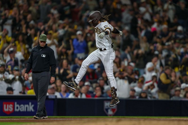 May 20, 2023; San Diego, California, USA; San Diego Padres right fielder Fernando Tatis Jr. (23) celebrates as he rounds third base after hitting a one run home run in the sixth inning against the Boston Red Sox at Petco Park. Mandatory Credit: David Frerker-USA TODAY Sports