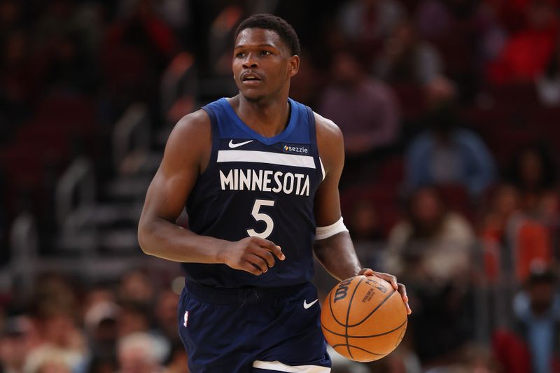 CHICAGO, ILLINOIS - OCTOBER 16: Anthony Edwards #5 of the Minnesota Timberwolves dribbles up the court against the Chicago Bulls during the second half of a preseason game at the United Center on October 16, 2024 in Chicago, Illinois. NOTE TO USER: User expressly acknowledges and agrees that, by downloading and or using this photograph, User is consenting to the terms and conditions of the Getty Images License Agreement.  (Photo by Michael Reaves/Getty Images)