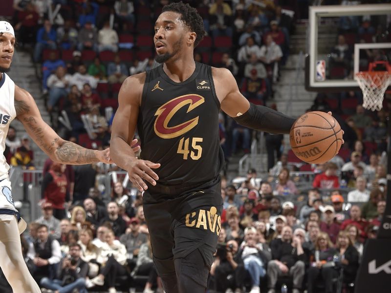 CLEVELAND, OH - APRIL 10: Donovan Mitchell #45 of the Cleveland Cavaliers dribbles the ball during the game against the Memphis Grizzlies on April 10, 2024 at Rocket Mortgage FieldHouse in Cleveland, Ohio. NOTE TO USER: User expressly acknowledges and agrees that, by downloading and/or using this Photograph, user is consenting to the terms and conditions of the Getty Images License Agreement. Mandatory Copyright Notice: Copyright 2024 NBAE (Photo by David Liam Kyle/NBAE via Getty Images)