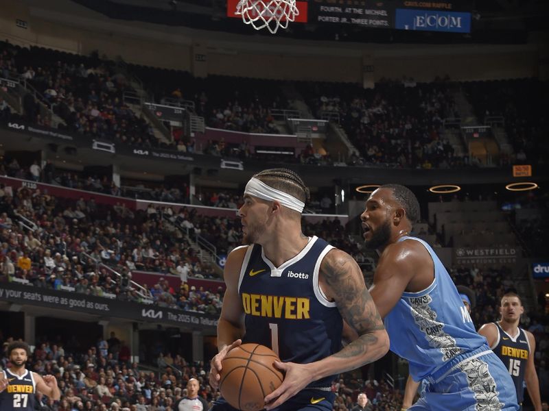 CLEVELAND, OH - DECEMBER 8: Michael Porter Jr. #1 of the Denver Nuggets looks to pass the ball during the game against the Cleveland Cavaliers on December 5, 2024 at Rocket Mortgage FieldHouse in Cleveland, Ohio. NOTE TO USER: User expressly acknowledges and agrees that, by downloading and/or using this Photograph, user is consenting to the terms and conditions of the Getty Images License Agreement. Mandatory Copyright Notice: Copyright 2024 NBAE (Photo by David Liam Kyle/NBAE via Getty Images)