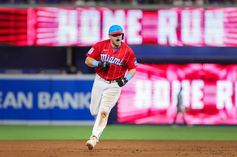 Sep 16, 2023; Miami, Florida, USA; Miami Marlins third baseman Jake Burger (36) reacts after hitting a two-run home run against the Atlanta Braves during the eighth inning at loanDepot Park. Mandatory Credit: Sam Navarro-USA TODAY Sports