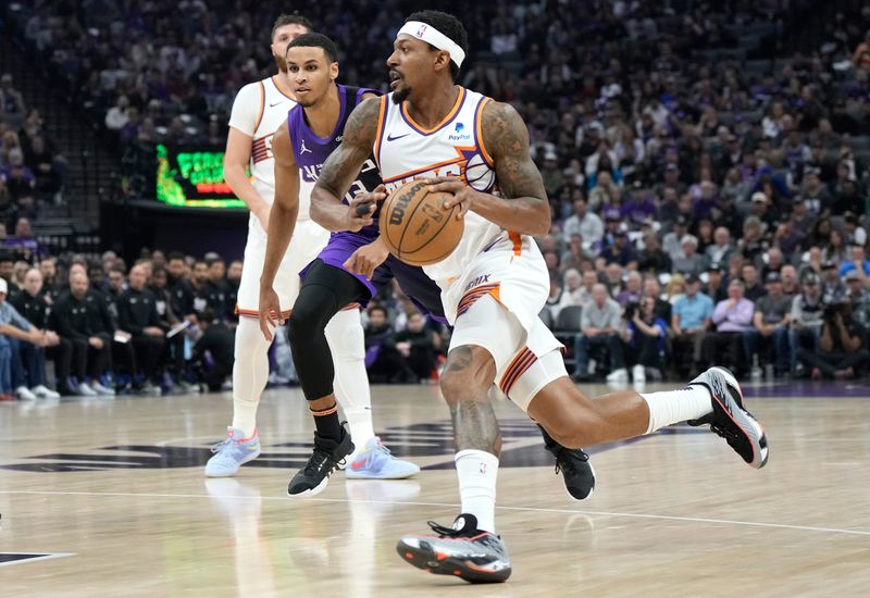 SACRAMENTO, CALIFORNIA - APRIL 12: Bradley Beal #3 of the Phoenix Suns drives towards the basket past Keegan Murray #13 of the Sacramento Kings during the first half of an NBA basketball game at Golden 1 Center on April 12, 2024 in Sacramento, California. NOTE TO USER: User expressly acknowledges and agrees that, by downloading and or using this photograph, User is consenting to the terms and conditions of the Getty Images License Agreement. (Photo by Thearon W. Henderson/Getty Images)