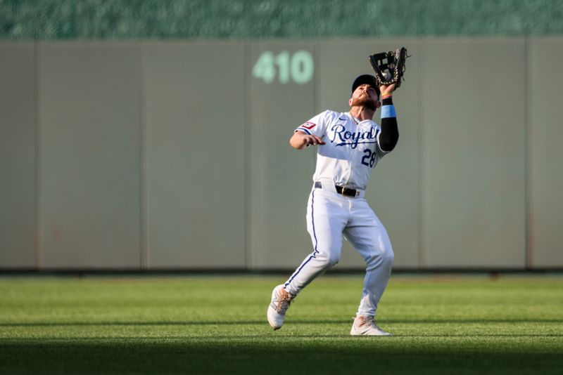 Jun 24, 2024; Kansas City, Missouri, USA; Kansas City Royals outfielder Kyle Isbel (28) catches a fly ball during the first inning against the Miami Marlins at Kauffman Stadium. Mandatory Credit: William Purnell-USA TODAY Sports