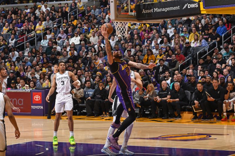 LOS ANGELES, CA - FEBRUARY 23: Anthony Davis #3 of the Los Angeles Lakers drives to the basket during the game against the San Antonio Spurs on Feburary 23, 2024 at Crypto.Com Arena in Los Angeles, California. NOTE TO USER: User expressly acknowledges and agrees that, by downloading and/or using this Photograph, user is consenting to the terms and conditions of the Getty Images License Agreement. Mandatory Copyright Notice: Copyright 2024 NBAE (Photo by Andrew D. Bernstein/NBAE via Getty Images)