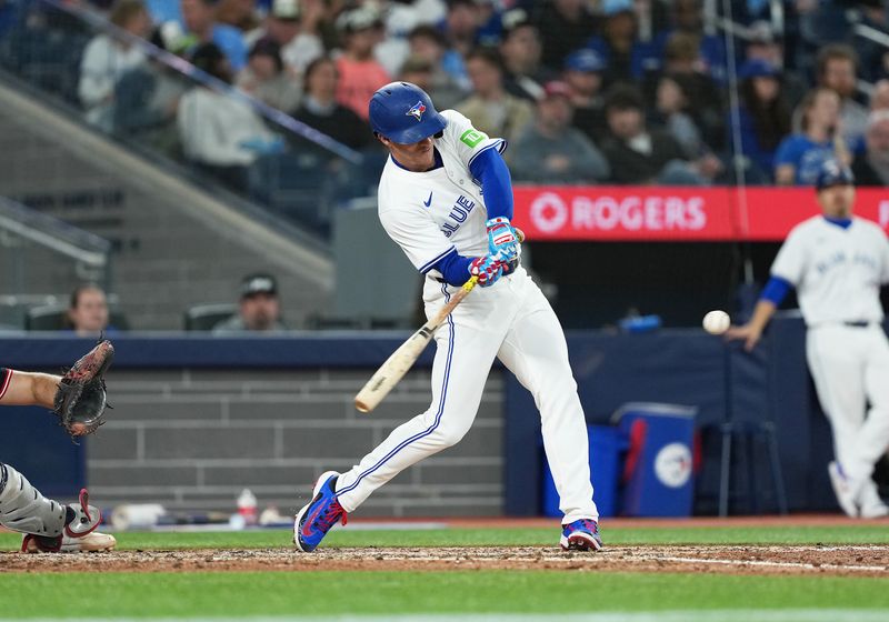 May 3, 2025; Toronto, Ontario, CAN; Toronto Blue Jays pinch hitter Myles Straw (3) hits a sacrifice fly ball advancing the runner to third base against the Cleveland Guardians during the fifth inning at Rogers Centre. Mandatory Credit: Nick Turchiaro-Imagn Images