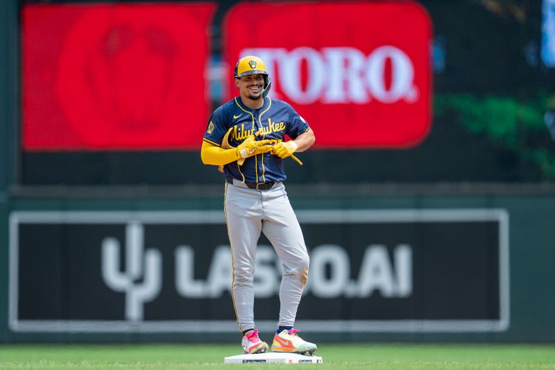 Jul 21, 2024; Minneapolis, Minnesota, USA; Milwaukee Brewers shortstop Willy Adames (27) reacts after hitting a double off Minnesota Twins pitcher Joe Ryan (not shown) in the sixth inning at Target Field. Mandatory Credit: Matt Blewett-USA TODAY Sports