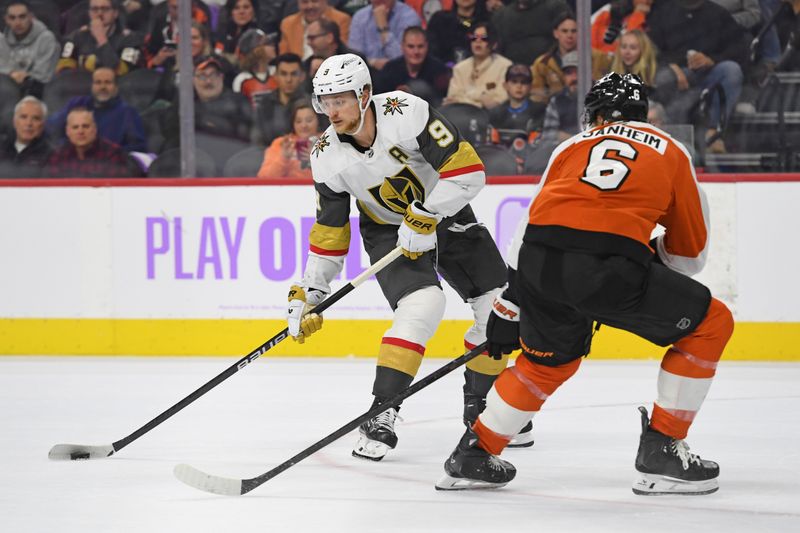 Nov 25, 2024; Philadelphia, Pennsylvania, USA; Vegas Golden Knights center Jack Eichel (9) controls the puck against Philadelphia Flyers defenseman Travis Sanheim (6) during the third period at Wells Fargo Center. Mandatory Credit: Eric Hartline-Imagn Images