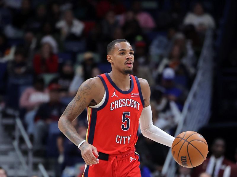 NEW ORLEANS, LOUISIANA - DECEMBER 12: Dejounte Murray #5 of the New Orleans Pelicans drives with the ball against the Sacramento Kings during a game at the Smoothie King Center on December 12, 2024 in New Orleans, Louisiana. NOTE TO USER: User expressly acknowledges and agrees that, by downloading and or using this Photograph, user is consenting to the terms and conditions of the Getty Images License Agreement. (Photo by Jonathan Bachman/Getty Images)