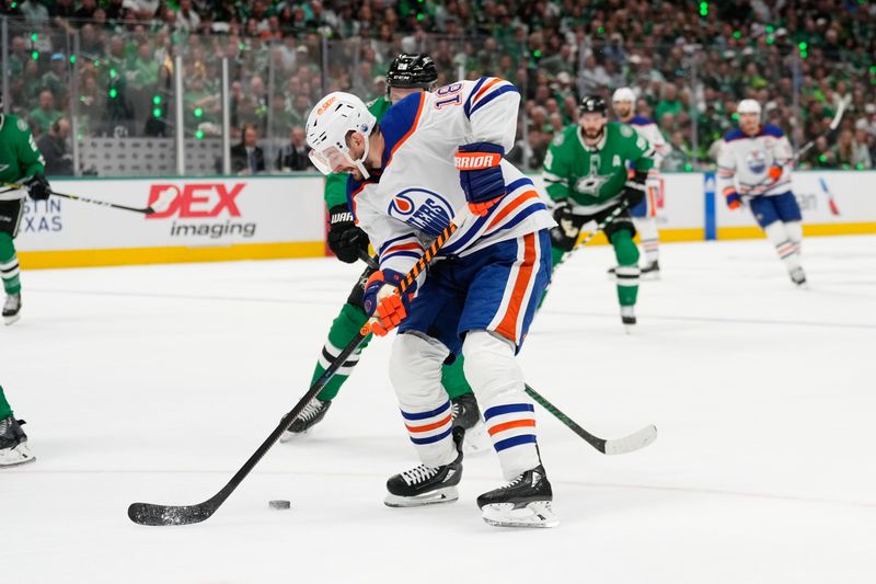 May 31, 2024; Dallas, Texas, USA; Edmonton Oilers left wing Zach Hyman (18) skates with the puck as Dallas Stars center Tyler Seguin (91) defends during the first period between the Dallas Stars and the Edmonton Oilers in game five of the Western Conference Final of the 2024 Stanley Cup Playoffs at American Airlines Center. Mandatory Credit: Chris Jones-USA TODAY Sports