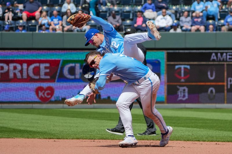 Apr 11, 2024; Kansas City, Missouri, USA; Kansas City Royals second base Nick Loftin (12) dives over shortstop Bobby Witt Jr. (7) going for a ground ball against the Houston Astros in the fourth inning at Kauffman Stadium. Mandatory Credit: Denny Medley-USA TODAY Sports