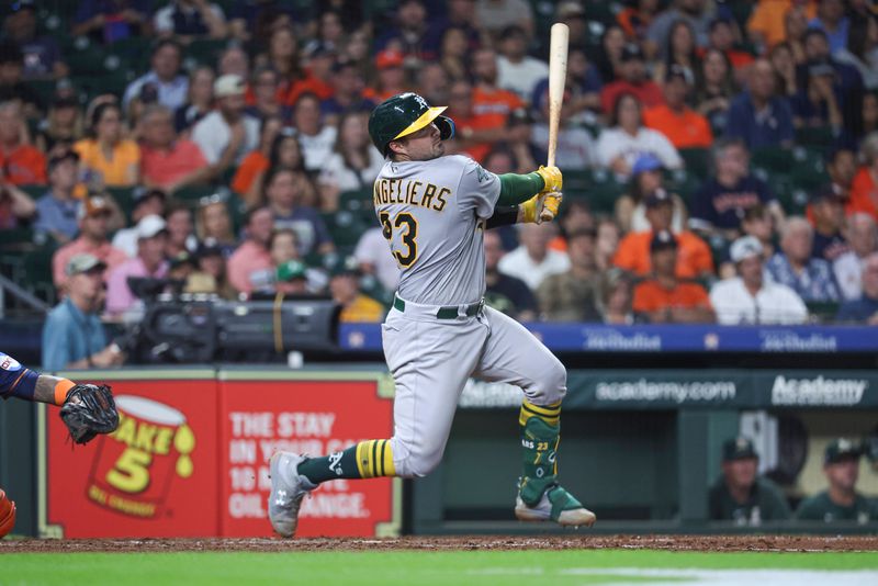 Sep 11, 2023; Houston, Texas, USA; Oakland Athletics catcher Shea Langeliers (23) hits a home run during the seventh inning against the Houston Astros at Minute Maid Park. Mandatory Credit: Troy Taormina-USA TODAY Sports