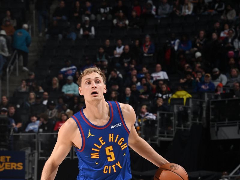 DETROIT, MI - FEBRUARY 28: Hunter Tyson #5 of the Denver Nuggets dribbles the ball during the game against the Detroit Pistons on February 28, 2025 at Little Caesars Arena in Detroit, Michigan. NOTE TO USER: User expressly acknowledges and agrees that, by downloading and/or using this photograph, User is consenting to the terms and conditions of the Getty Images License Agreement. Mandatory Copyright Notice: Copyright 2025 NBAE (Photo by Chris Schwegler/NBAE via Getty Images)