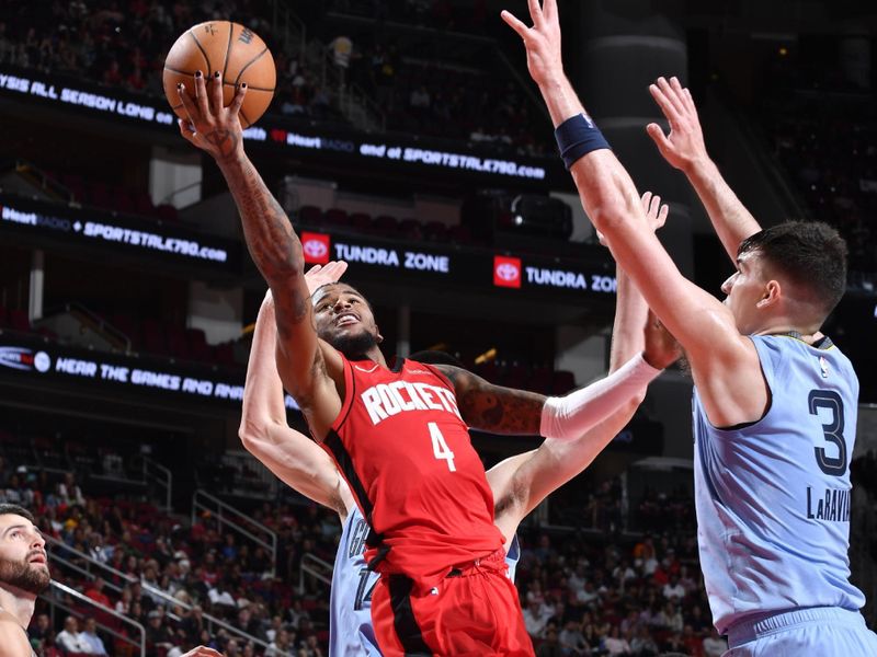 HOUSTON, TX - OCTOBER 25: Jalen Green #4 of the Houston Rockets drives to the basket during the game against the Memphis Grizzlies on October 25, 2024 at the Toyota Center in Houston, Texas. NOTE TO USER: User expressly acknowledges and agrees that, by downloading and or using this photograph, User is consenting to the terms and conditions of the Getty Images License Agreement. Mandatory Copyright Notice: Copyright 2024 NBAE (Photo by Logan Riely/NBAE via Getty Images)