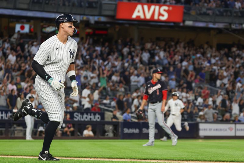 Aug 23, 2023; Bronx, New York, USA; New York Yankees right fielder Aaron Judge (99) hits a grand slam home run during the second inning against Washington Nationals starting pitcher MacKenzie Gore (1) at Yankee Stadium. Mandatory Credit: Vincent Carchietta-USA TODAY Sports