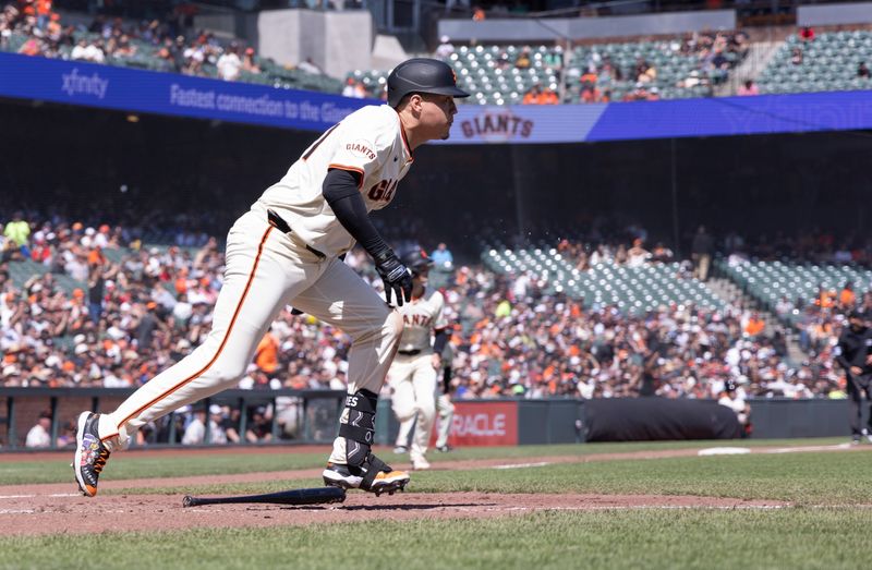 Apr 9, 2025; San Francisco, California, USA;  San Francisco Giants designated hitter Wilmer Flores (41) hits an RBI single against the Cincinnati Reds during the sixth inning at Oracle Park. Mandatory Credit: Kelley L Cox-Imagn Images