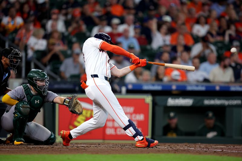 Sep 12, 2024; Houston, Texas, USA; Houston Astros designated hitter Kyle Tucker (30) hits a double to right field against the Oakland Athletics during the third inning at Minute Maid Park. Mandatory Credit: Erik Williams-Imagn Images