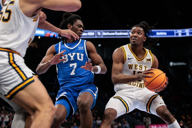 Mar 11, 2026; Kansas City, MO, USA; West Virginia Mountaineers guard Chance Moore (13) drives to the basket around BYU Cougars forward Khadim Mboup (7) during the first half at T-Mobile Center. Mandatory Credit: William Purnell-Imagn Images Mar 11, 2026; Kansas City, MO, USA; West Virginia Mountaineers guard Chance Moore (13) drives to the basket around BYU Cougars forward Khadim Mboup (7) during the first half at T-Mobile Center. Mandatory Credit: William Purnell-Imagn Images