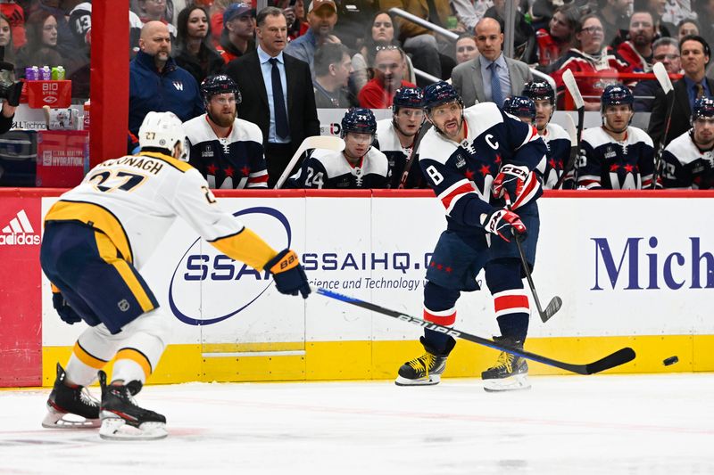 Dec 30, 2023; Washington, District of Columbia, USA; Washington Capitals left wing Alex Ovechkin (8) passes the puck past Nashville Predators defenseman Ryan McDonagh (27) during the first period at Capital One Arena. Mandatory Credit: Brad Mills-USA TODAY Sports