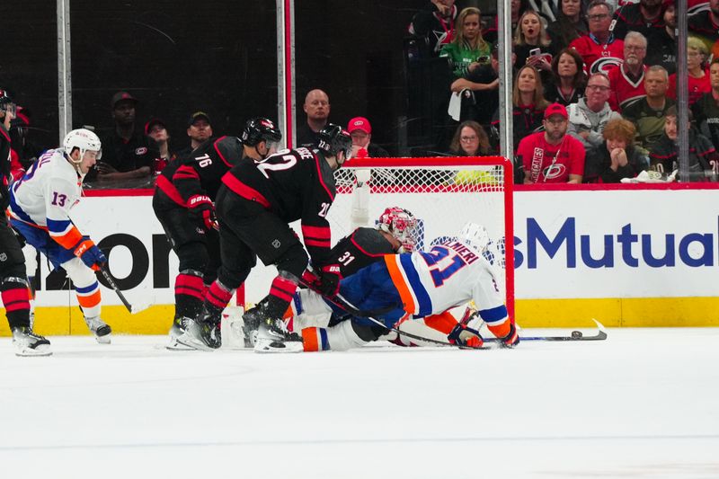 Apr 20, 2024; Raleigh, North Carolina, USA; New York Islanders center Kyle Palmieri (21) misses on his scoring attempt against Carolina Hurricanes goaltender Frederik Andersen (31) during the third period in game one of the first round of the 2024 Stanley Cup Playoffs at PNC Arena. Mandatory Credit: James Guillory-USA TODAY Sports