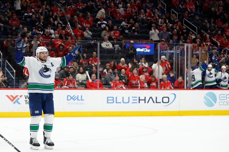 Feb 11, 2024; Washington, District of Columbia, USA; Vancouver Canucks center J.T. Miller (9) celebrates after scoring the game winning goal in overtime against the Washington Capitals at Capital One Arena. Mandatory Credit: Geoff Burke-USA TODAY Sports