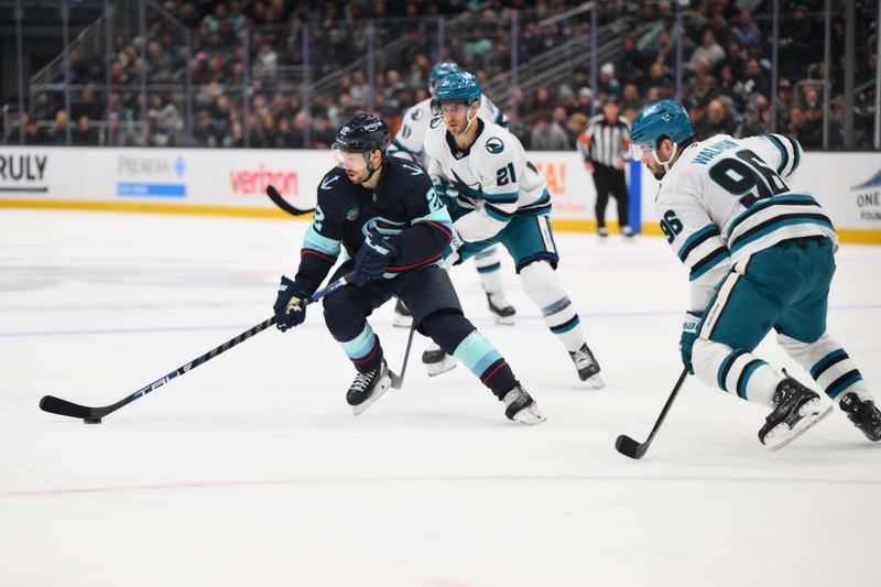 Nov 30, 2024; Seattle, Washington, USA; Seattle Kraken right wing Oliver Bjorkstrand (22) plays the puck during the second period against the San Jose Sharks at Climate Pledge Arena. Mandatory Credit: Steven Bisig-Imagn Images