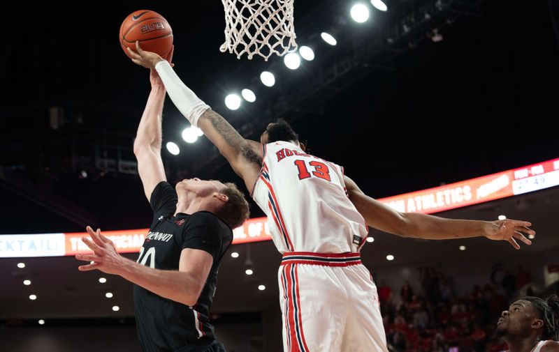 Jan 28, 2023; Houston, Texas, USA; Cincinnati Bearcats forward Viktor Lakhin (30) reaches for an offensive rebound against Houston Cougars forward J'Wan Roberts (13) in the second half at Fertitta Center. Houston Cougars won 75 to 69 .Mandatory Credit: Thomas Shea-USA TODAY Sports