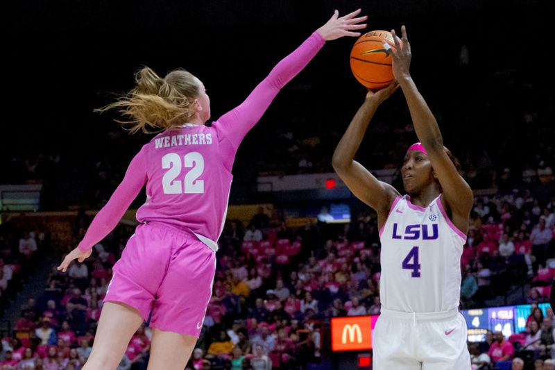 Feb 11, 2024; Baton Rouge, Louisiana, USA; LSU Lady Tigers guard Flau'jae Johnson (4) shoots against Alabama Crimson Tide guard Karly Weathers (22) during the first half at Pete Maravich Assembly Center. Mandatory Credit: Matthew Hinton-USA TODAY Sports