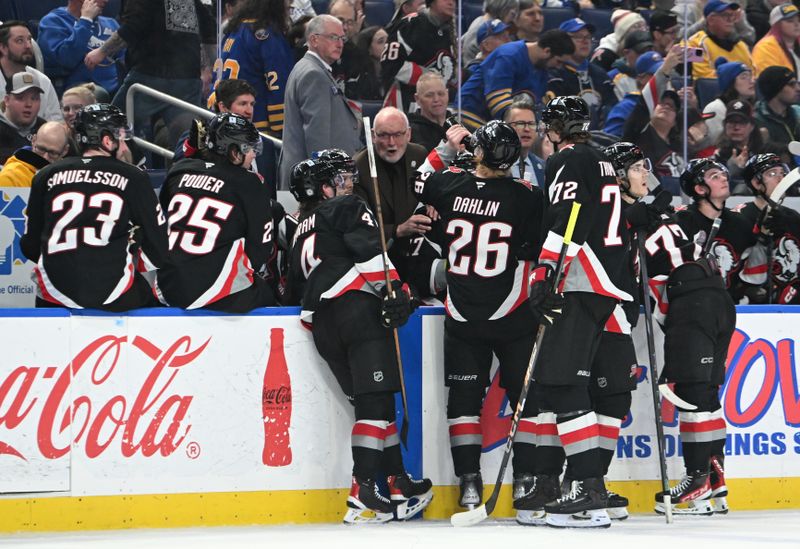 Jan 31, 2025; Buffalo, New York, USA; Buffalo Sabres head coach Lindy Ruff (center) gives instructions to his players in the third period game against the Nashville Predators at the KeyBank Center. Mandatory Credit: Mark Konezny-Imagn Images