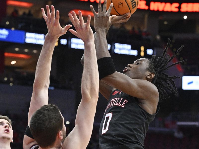 Mar 5, 2024; Louisville, Kentucky, USA; Louisville Cardinals guard Mike James (0) shoots against Virginia Tech Hokies forward Robbie Beran (31) during the second half at KFC Yum! Center. Virginia Tech defeated Louisville 80-64. Mandatory Credit: Jamie Rhodes-USA TODAY Sports