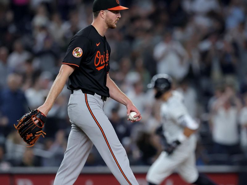 Sep 26, 2025; Bronx, New York, USA; Baltimore Orioles starting pitcher Trevor Rogers (28) reacts after giving up a two run home run to New York Yankees right fielder Aaron Judge (99) during the third inning at Yankee Stadium. Mandatory Credit: Brad Penner-Imagn Images
