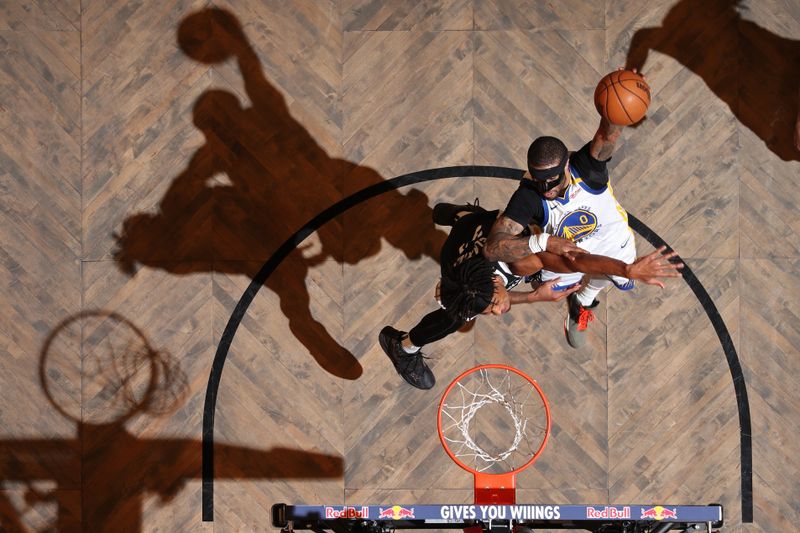 BROOKLYN, NY - MARCH 6: Gary Payton II #0 of the Golden State Warriors drives to the basket during the game against the Brooklyn Nets on March 6, 2025 at Barclays Center in Brooklyn, New York. NOTE TO USER: User expressly acknowledges and agrees that, by downloading and or using this Photograph, user is consenting to the terms and conditions of the Getty Images License Agreement. Mandatory Copyright Notice: Copyright 2025 NBAE(Photo by Nathaniel S. Butler/NBAE via Getty Images)