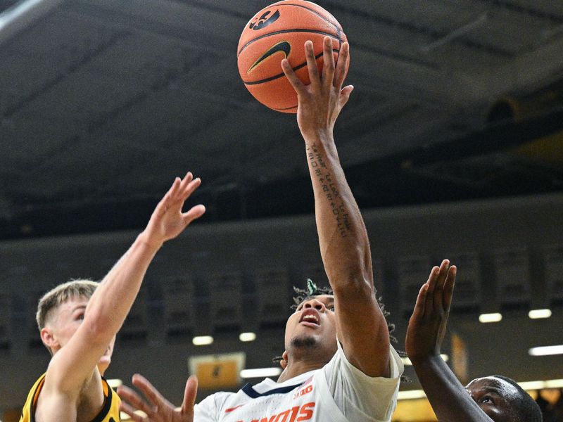 Mar 10, 2024; Iowa City, Iowa, USA; Illinois Fighting Illini guard Terrence Shannon Jr. (0) goes to the basket as Iowa Hawkeyes forward Ladji Dembele (13) and guard Josh Dix (4) defend during the first half at Carver-Hawkeye Arena. Mandatory Credit: Jeffrey Becker-USA TODAY Sports