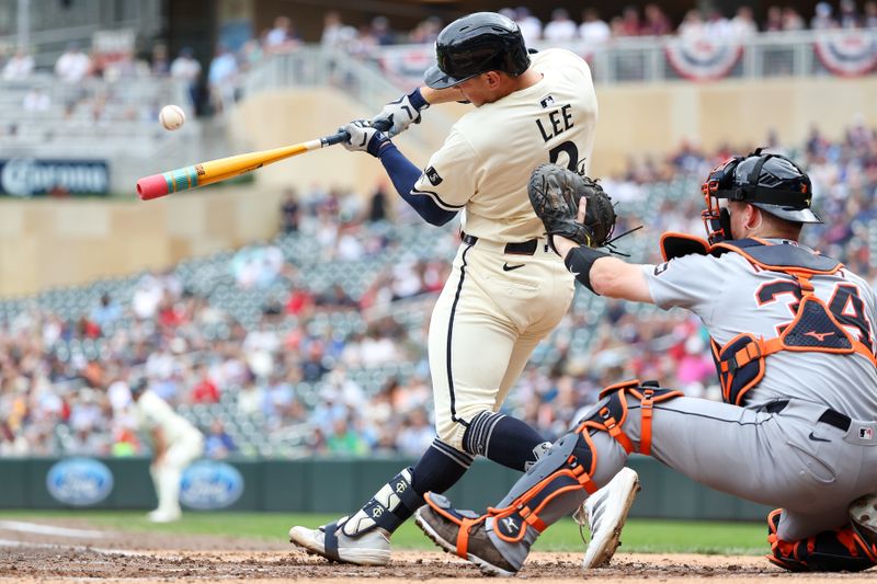 Aug 17, 2025; Minneapolis, Minnesota, USA; Minnesota Twins shortstop Brooks Lee (2) hits a grand slam against the Detroit Tigers during the third inning at Target Field. Mandatory Credit: Matt Krohn-Imagn Images