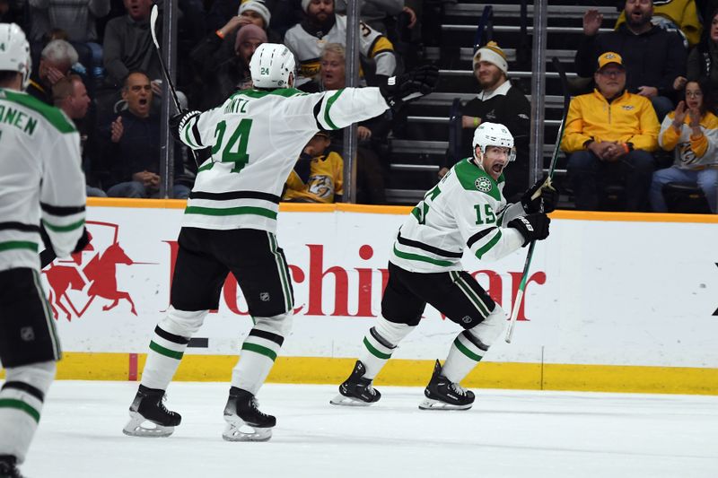 Dec 23, 2023; Nashville, Tennessee, USA; Dallas Stars center Craig Smith (15) celebrates with center Roope Hintz (24) after scoring to tie the game during the third period against the Nashville Predators at Bridgestone Arena. Mandatory Credit: Christopher Hanewinckel-USA TODAY Sports