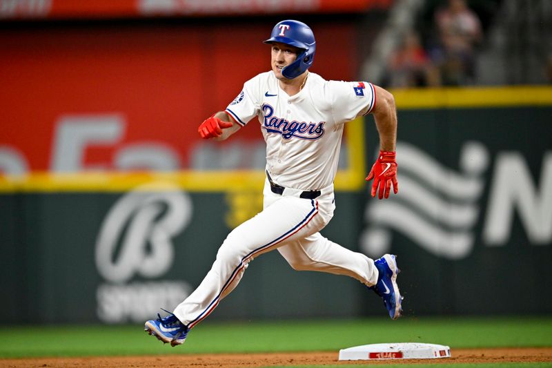 Jun 3, 2024; Arlington, Texas, USA; Texas Rangers left fielder Wyatt Langford (36) hits a triple against the Detroit Tigers during the fourth inning at Globe Life Field. Mandatory Credit: Jerome Miron-USA TODAY Sports