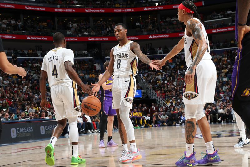 NEW ORLEANS, LA - NOVEMBER 16:  Jamal Cain #8, Javonte Green #4, and Brandon Boston Jr. #11 of the New Orleans Pelicans high five during the game against the Los Angeles Lakers on November 16, 2024 at the Smoothie King Center in New Orleans, Louisiana. NOTE TO USER: User expressly acknowledges and agrees that, by downloading and or using this Photograph, user is consenting to the terms and conditions of the Getty Images License Agreement. Mandatory Copyright Notice: Copyright 2024 NBAE (Photo by Layne Murdoch Jr./NBAE via Getty Images)