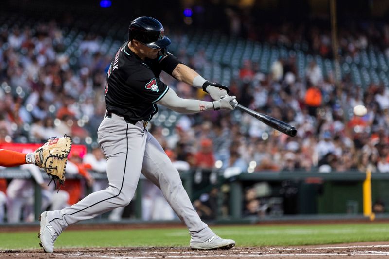 Sep 3, 2024; San Francisco, California, USA;  Arizona Diamondbacks left fielder Randal Grichuk (15) hits a single against the San Francisco Giants during the third inning at Oracle Park. Mandatory Credit: John Hefti-Imagn Images