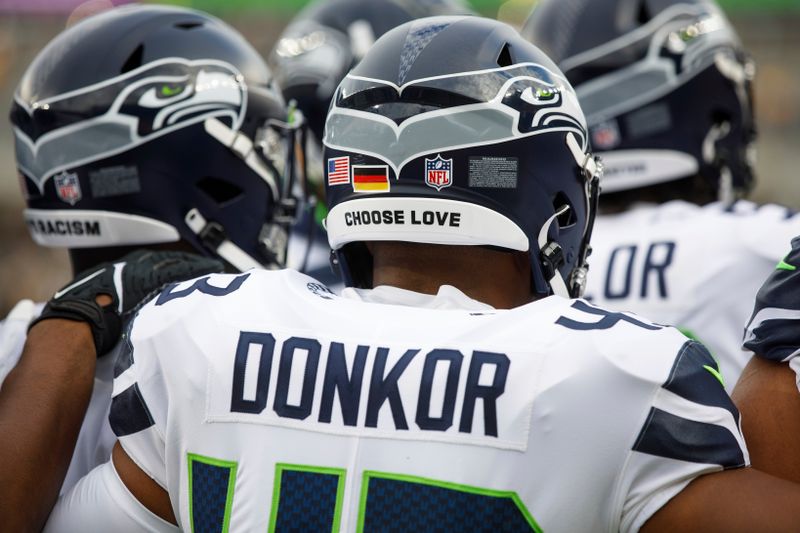 A German flag is pictured on the helmet of Seattle Seahawks linebacker Aaron Donkor (43) before a preseason NFL football game, Saturday, Aug. 13, 2022, in Pittsburgh, PA. (AP Photo/Matt Durisko)