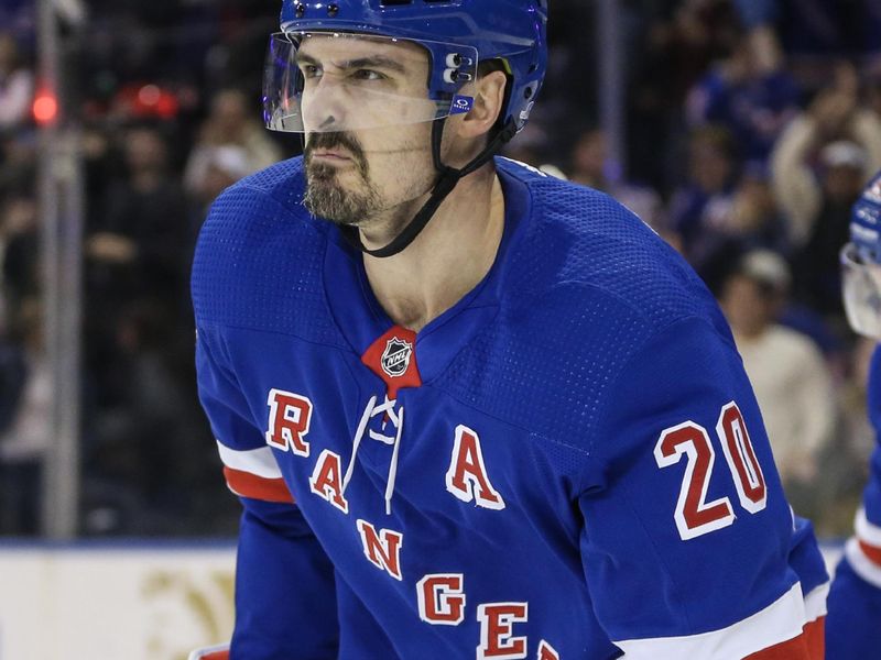 Nov 12, 2023; New York, New York, USA;  New York Rangers left wing Chris Kreider (20) celebrates after making an assist on a game tying goal in the third period against the Columbus Blue Jackets at Madison Square Garden. Mandatory Credit: Wendell Cruz-USA TODAY Sports