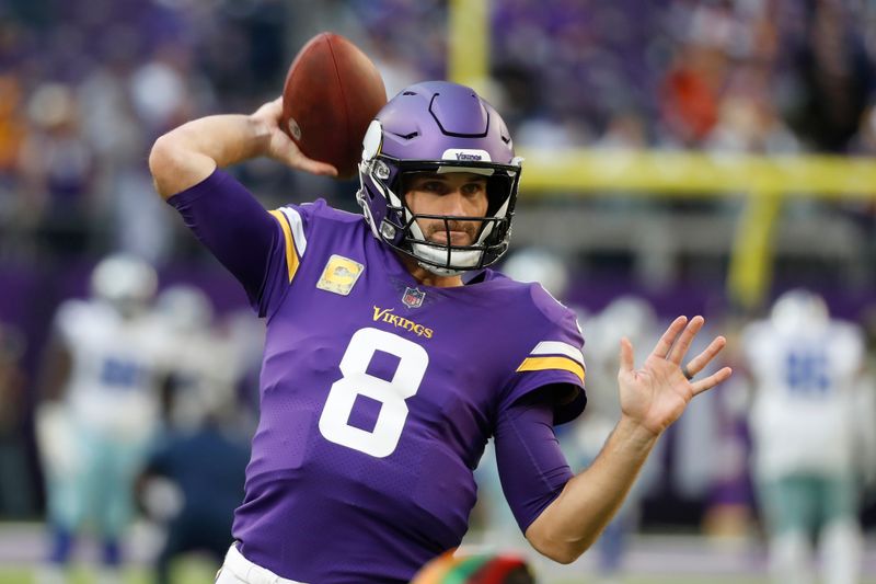 Minnesota Vikings quarterback Kirk Cousins warms up before an NFL football game against the Dallas Cowboys, Sunday, Nov. 20, 2022, in Minneapolis. (AP Photo/Bruce Kluckhohn)
