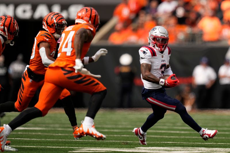 New England Patriots wide receiver DeMario Douglas (3) runs after catching a pass during the first half of an NFL football game against the Cincinnati Bengals, Sunday, Sept. 8, 2024, in Cincinnati. (AP Photo/Carolyn Kaster)