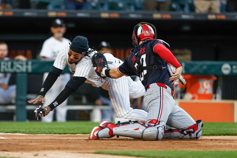 Apr 30, 2024; Chicago, Illinois, USA; Chicago White Sox catcher Martín Maldonado (15) is tagged out by Minnesota Twins catcher Ryan Jeffers (27) at home plate during the third inning at Guaranteed Rate Field. Mandatory Credit: Kamil Krzaczynski-USA TODAY Sports