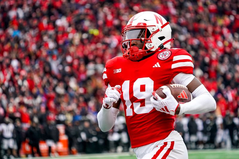 Oct 28, 2023; Lincoln, Nebraska, USA; Nebraska Cornhuskers wide receiver Jaylen Lloyd (19) scores a touchdown against the Purdue Boilermakers during the second quarter at Memorial Stadium. Mandatory Credit: Dylan Widger-USA TODAY Sports