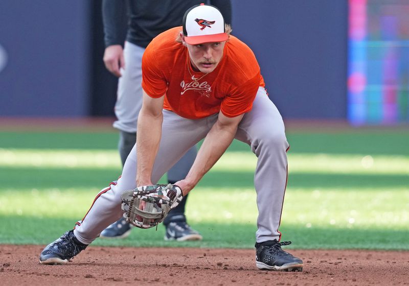 Jun 3, 2024; Toronto, Ontario, CAN; Baltimore Orioles shortstop Gunnar Henderson (2) fields balls during batting practice before a game against the Toronto Blue Jays at Rogers Centre. Mandatory Credit: Nick Turchiaro-USA TODAY Sports