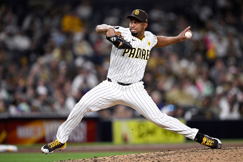 May 13, 2024; San Diego, California, USA; San Diego Padres relief pitcher Wandy Peralta (58) throws a pitch against the Colorado Rockies during the ninth inning at Petco Park. Mandatory Credit: Orlando Ramirez-USA TODAY Sports